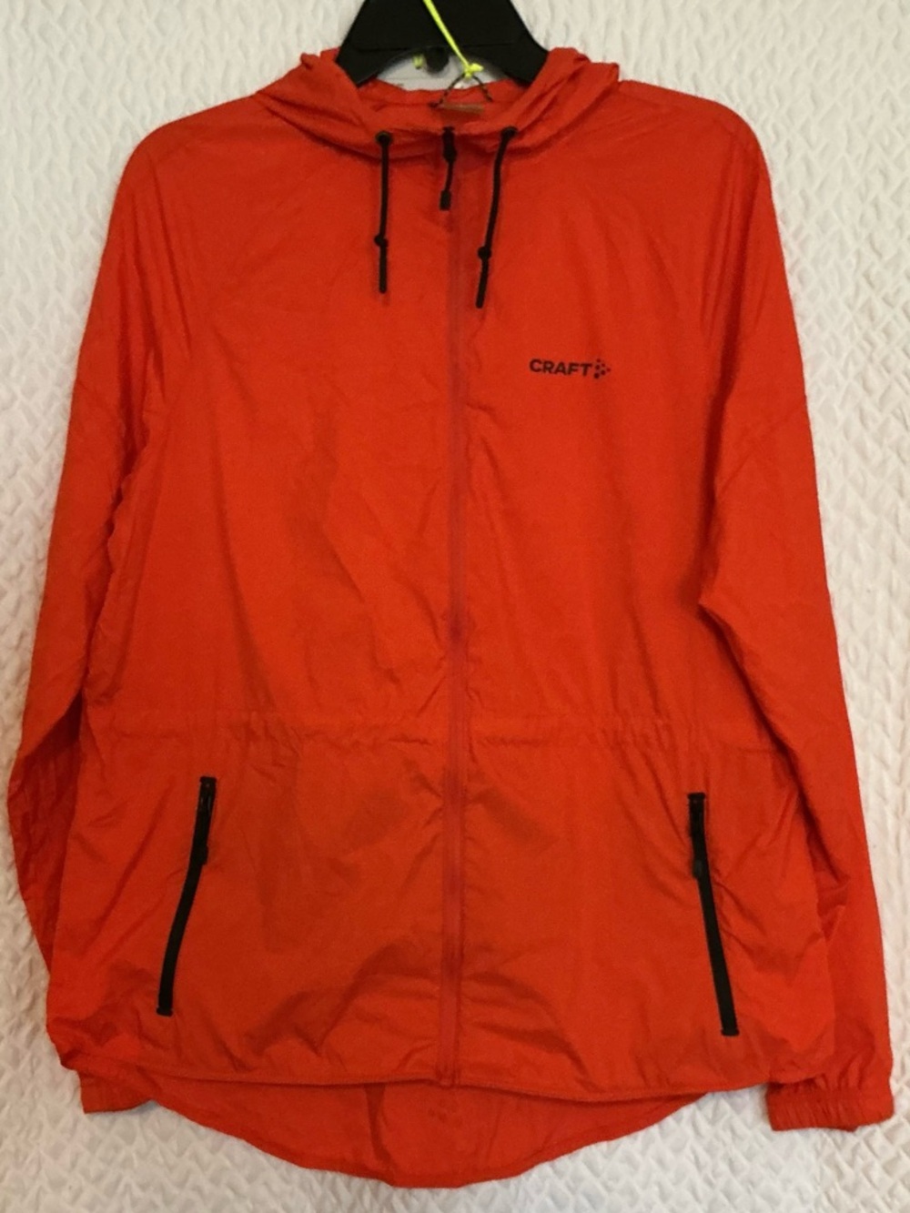 Craft Men's Hooded Windbreaker in Bright Orange with Black Accents
